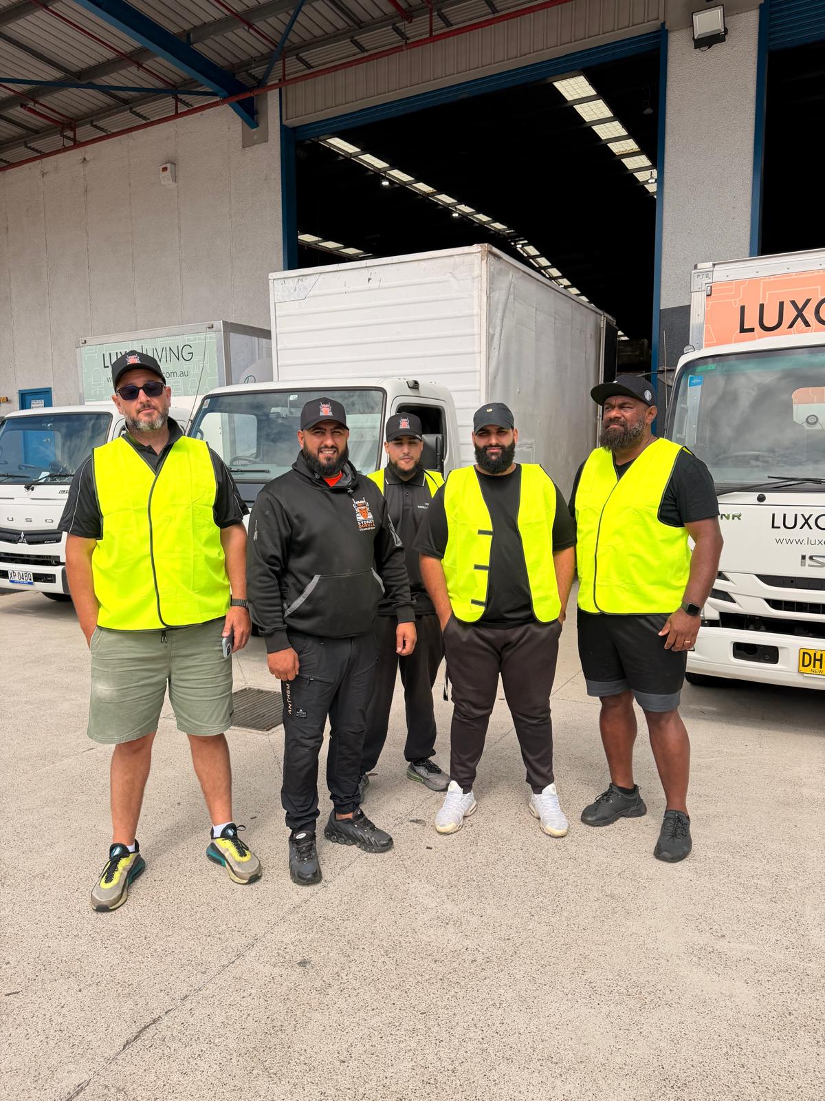 Sydney Gorilla Transport crew in hi-vis with trucks